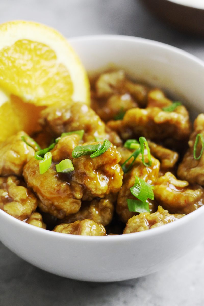 Close-up of a bowl of Chinese orange chicken.