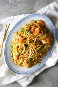 Overview of shrimp chow mein on a Chinese plate.