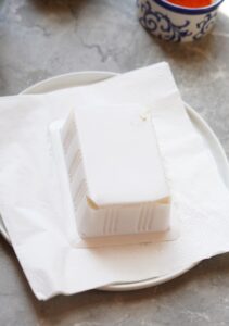 Silk tofu draining on a paper towel.