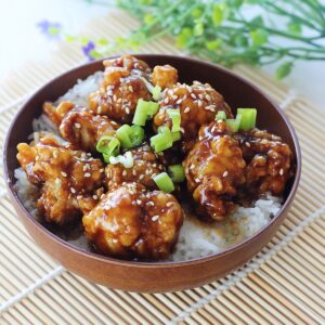 Side view of honey garlic crispy chicken.