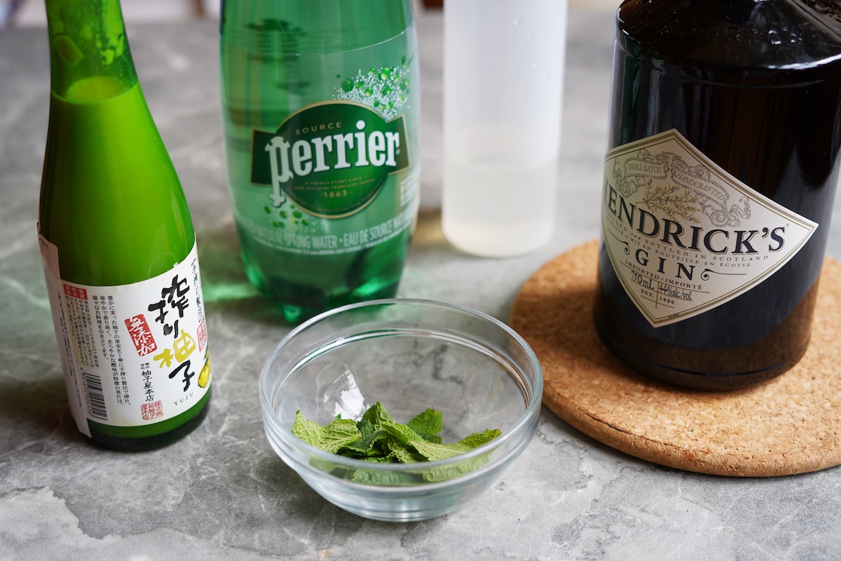 Ingredients needed to make yuzu gin cocktail. 