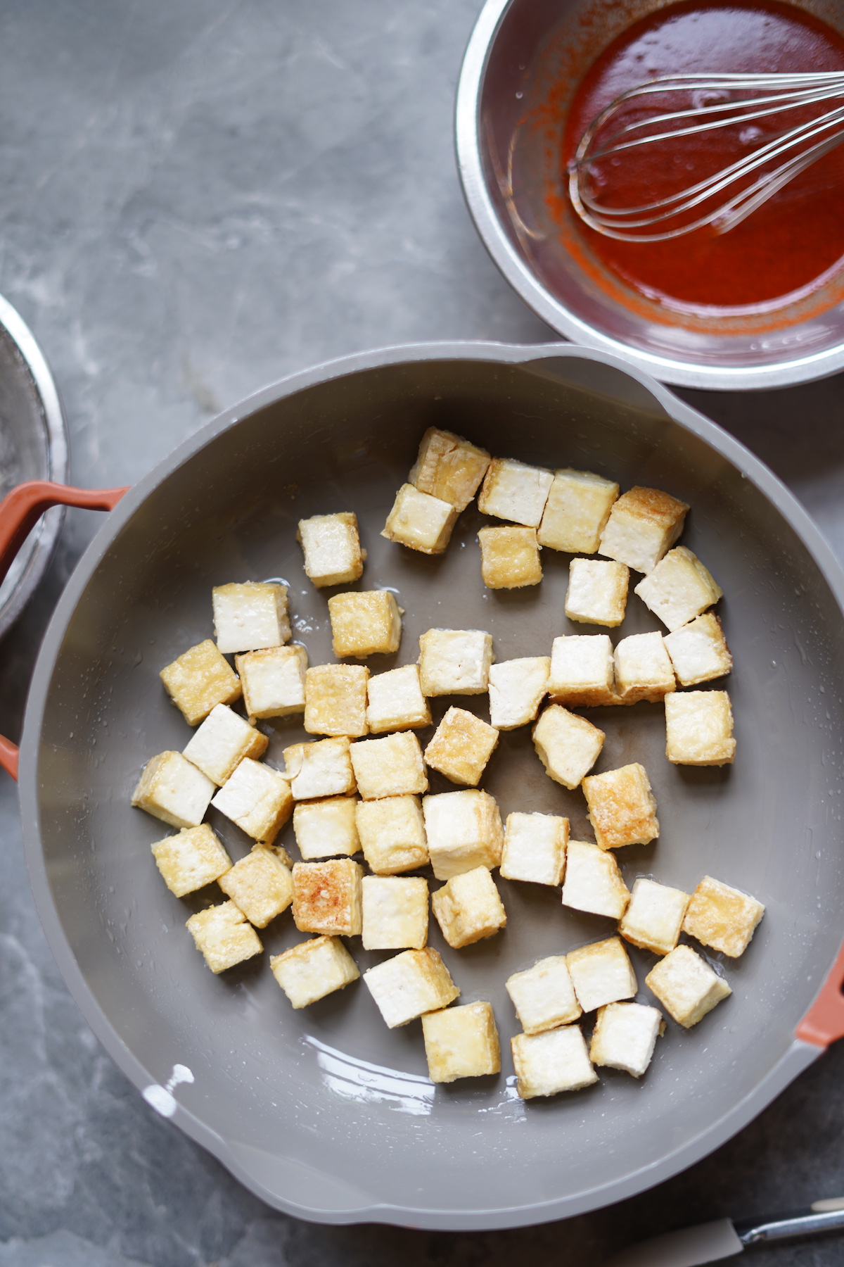 Pan-fry tofu cubes until golden.