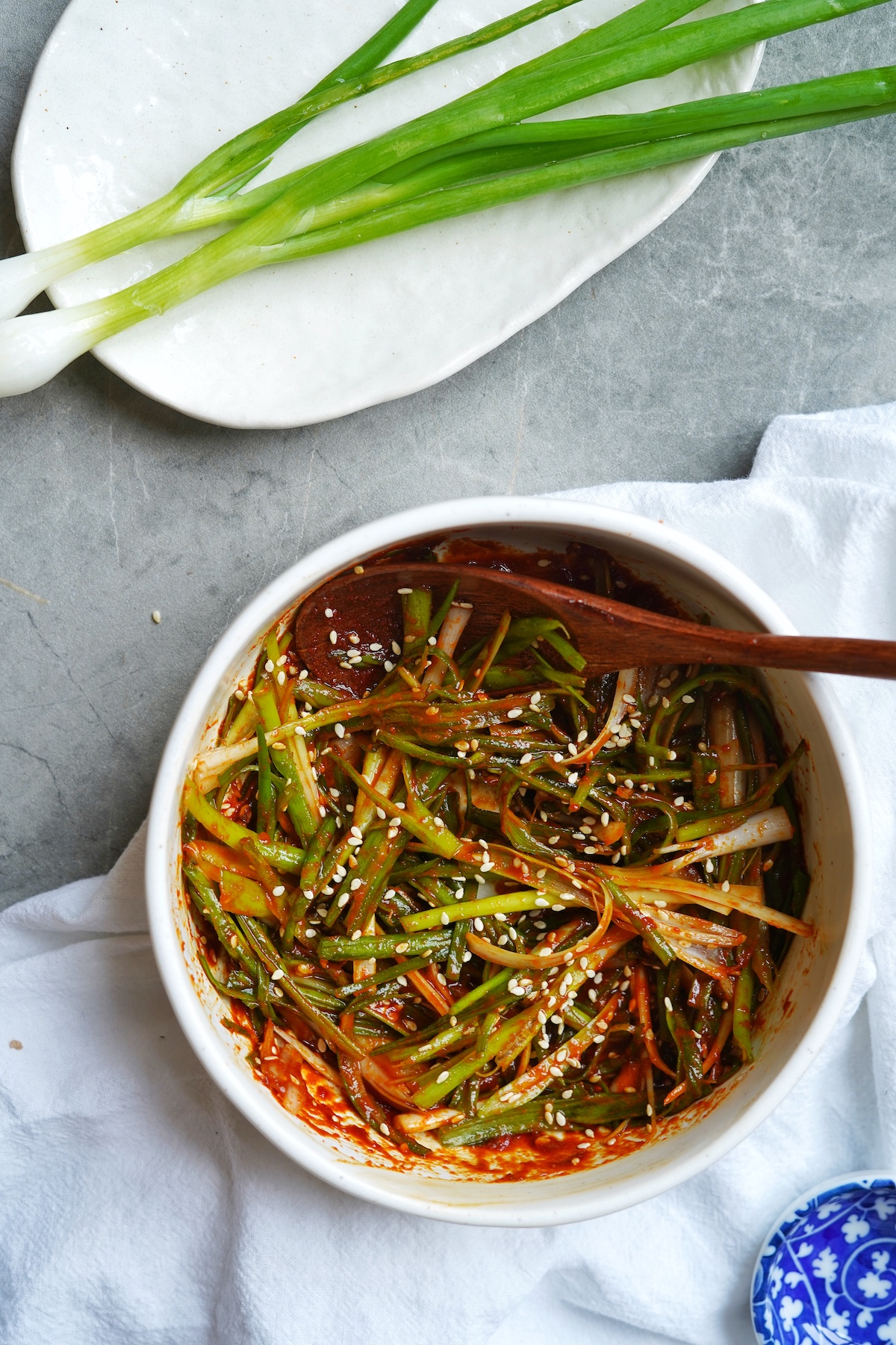 Bird's view of a bowl filled with korean green onion salad.